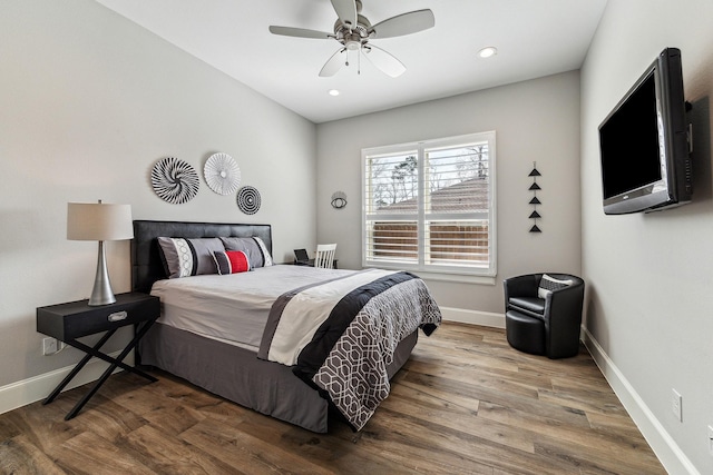 bedroom featuring a ceiling fan, recessed lighting, wood finished floors, and baseboards