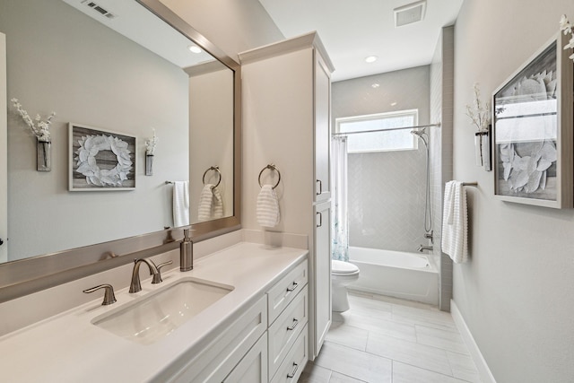 bathroom with vanity, shower / bath combo with shower curtain, toilet, and visible vents