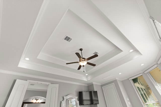 room details with ornamental molding, a raised ceiling, and visible vents