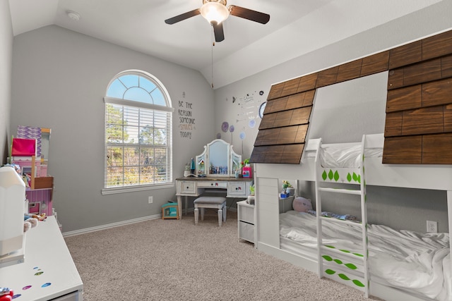 bedroom with carpet floors, vaulted ceiling, baseboards, and ceiling fan