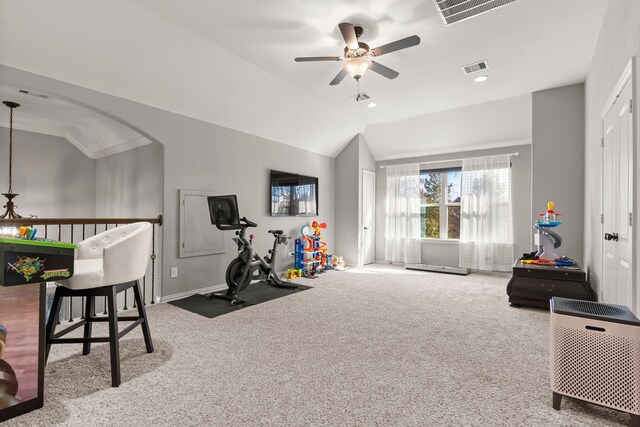 workout room featuring a ceiling fan, lofted ceiling, visible vents, and carpet flooring