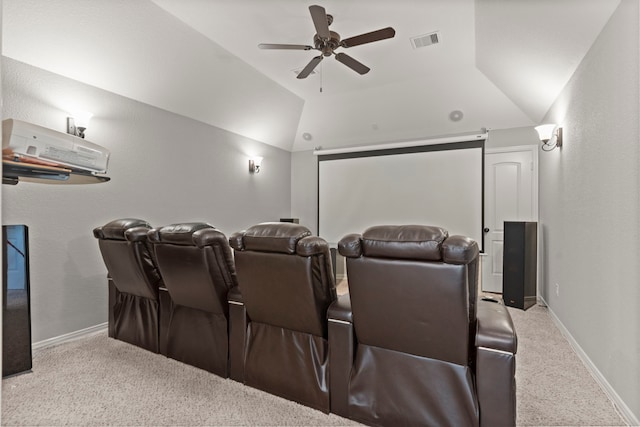 home theater room with baseboards, visible vents, lofted ceiling, ceiling fan, and carpet flooring