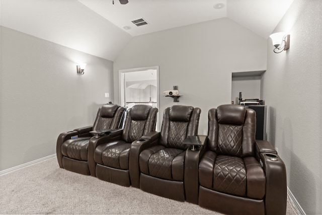 cinema featuring carpet floors, visible vents, vaulted ceiling, and a ceiling fan