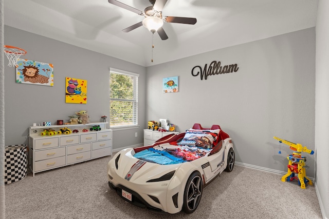 bedroom with ceiling fan, carpet, baseboards, and vaulted ceiling