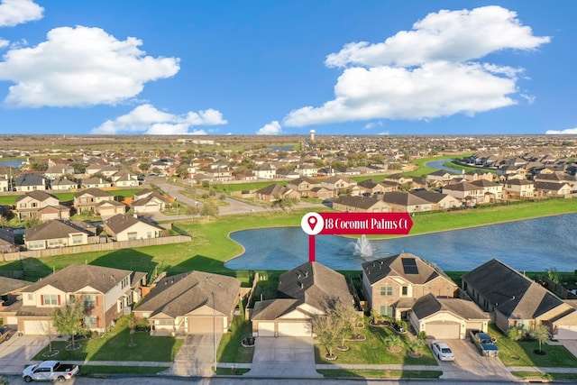 aerial view featuring a residential view and a water view