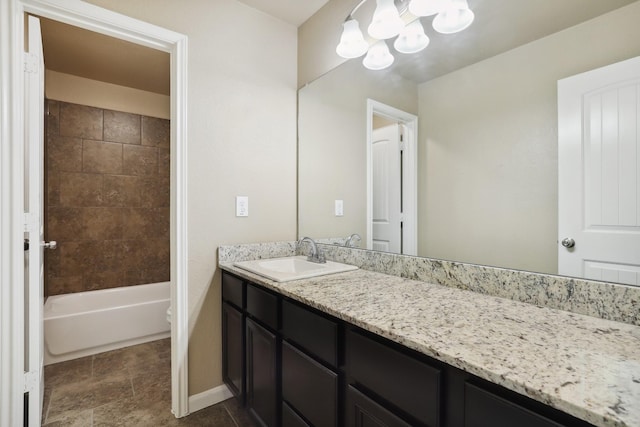 full bathroom with shower / bathtub combination, baseboards, a notable chandelier, and vanity