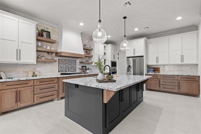 kitchen featuring open shelves, appliances with stainless steel finishes, custom exhaust hood, and white cabinetry