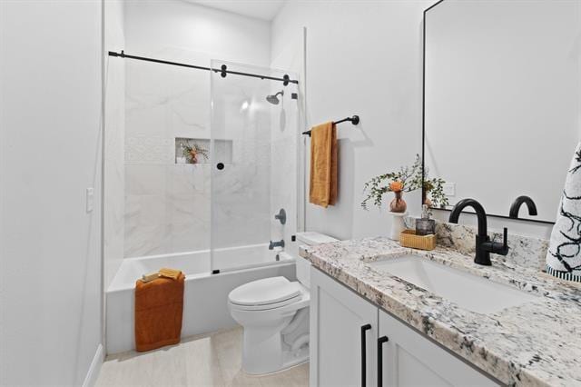 full bath featuring shower / washtub combination, vanity, and toilet