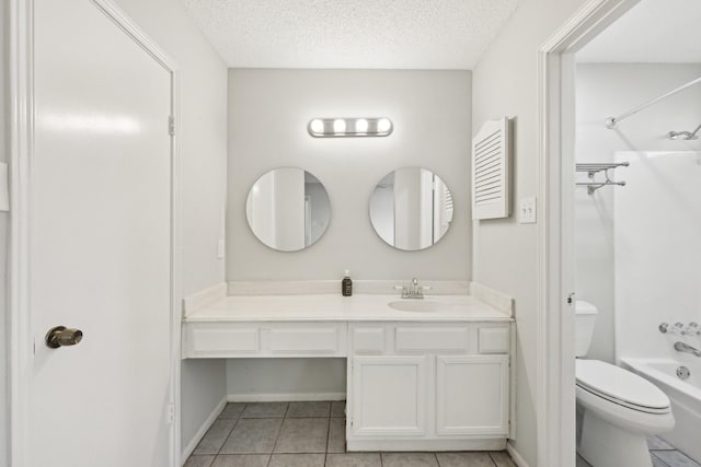 bathroom featuring shower / washtub combination, toilet, a textured ceiling, vanity, and tile patterned flooring