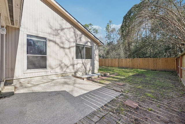 view of yard with a patio area and a fenced backyard