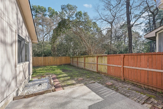 view of yard featuring a fenced backyard and a patio