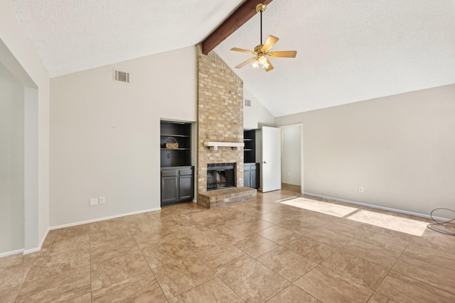 unfurnished living room with visible vents, ceiling fan, beamed ceiling, a textured ceiling, and a fireplace