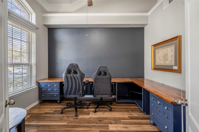 office area with visible vents, plenty of natural light, crown molding, and wood finished floors