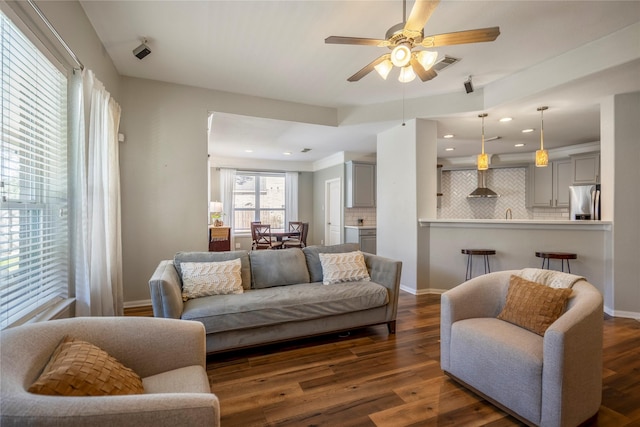 living room featuring visible vents, baseboards, dark wood finished floors, recessed lighting, and a ceiling fan