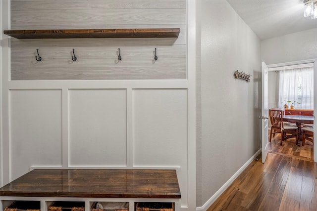 mudroom with baseboards and wood-type flooring