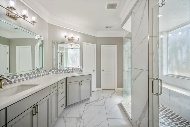 bathroom featuring ornamental molding, marble finish floor, a marble finish shower, and a sink