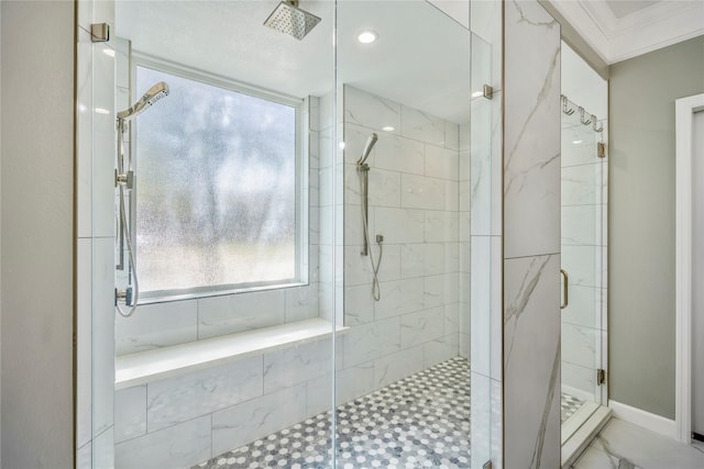 bathroom featuring crown molding and a stall shower