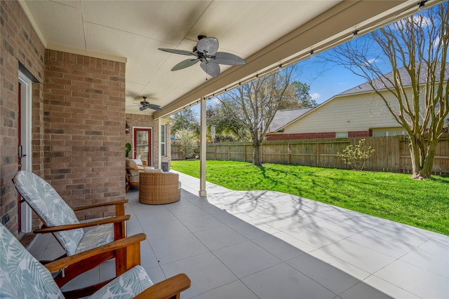 view of patio / terrace with a fenced backyard and ceiling fan