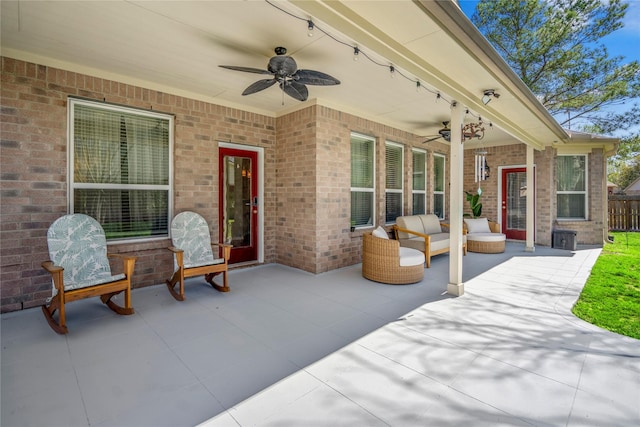 view of patio with outdoor lounge area and a ceiling fan