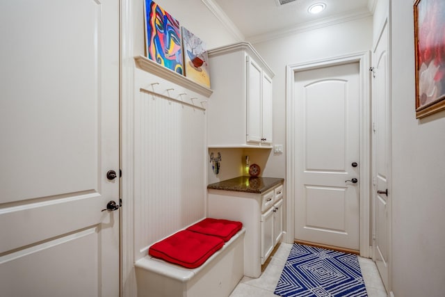 mudroom featuring light tile patterned floors and ornamental molding