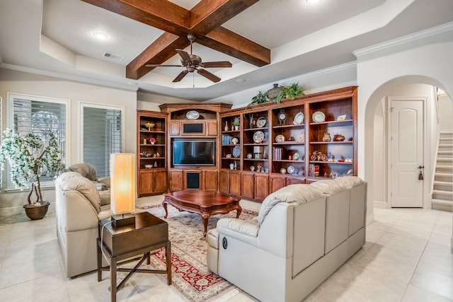 living room featuring arched walkways, coffered ceiling, visible vents, stairs, and beamed ceiling