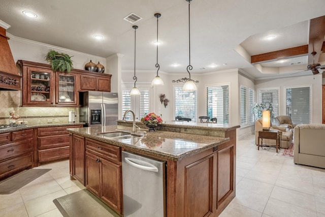 kitchen with light tile patterned floors, stainless steel appliances, a sink, visible vents, and backsplash