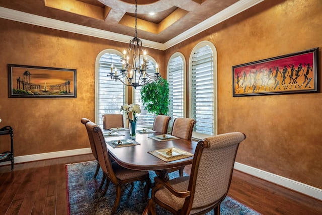 dining area with hardwood / wood-style flooring, crown molding, baseboards, and a notable chandelier