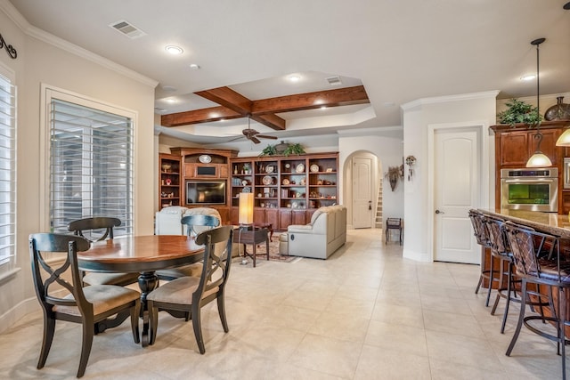 dining room featuring arched walkways, visible vents, ornamental molding, ceiling fan, and coffered ceiling