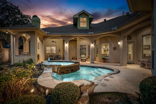 view of swimming pool with a patio area and an in ground hot tub