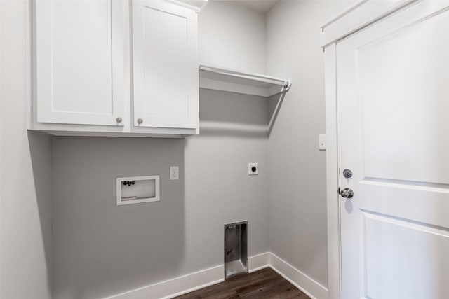 washroom featuring hookup for a washing machine, dark wood-type flooring, baseboards, cabinet space, and electric dryer hookup