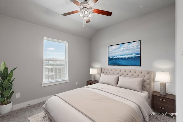 bedroom with lofted ceiling, a ceiling fan, baseboards, and carpet flooring