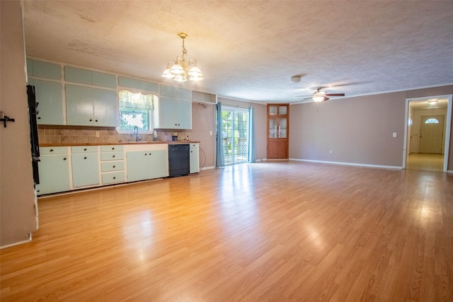 kitchen featuring black dishwasher, light wood-style flooring, a textured ceiling, a sink, and ceiling fan with notable chandelier