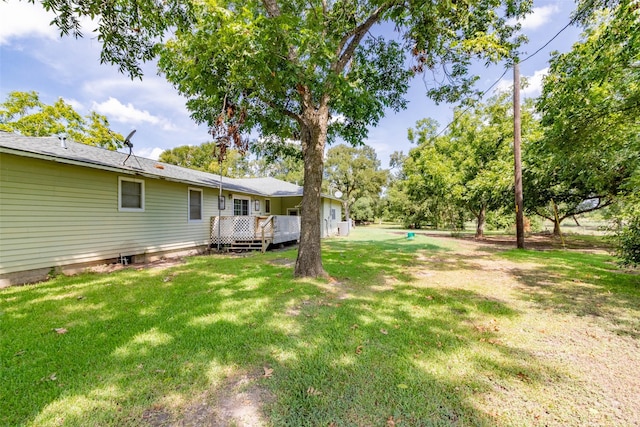 view of yard featuring a wooden deck