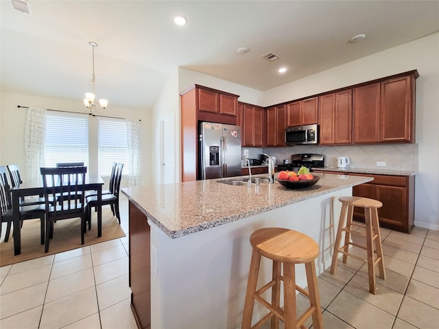 kitchen with light tile patterned floors, visible vents, appliances with stainless steel finishes, and a sink