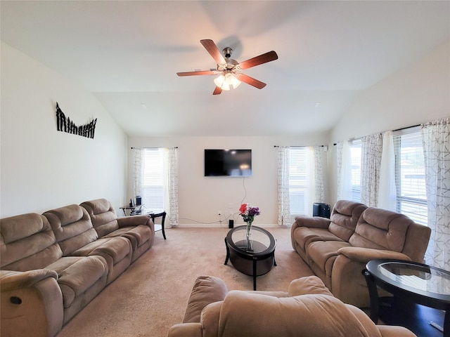 living area featuring light carpet, lofted ceiling, a ceiling fan, and baseboards