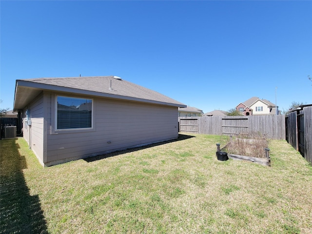 view of property exterior featuring a fenced backyard, central AC unit, and a yard