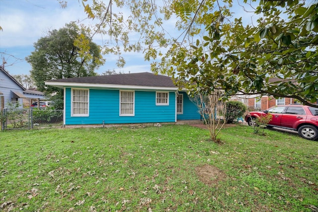 single story home featuring a front yard and fence