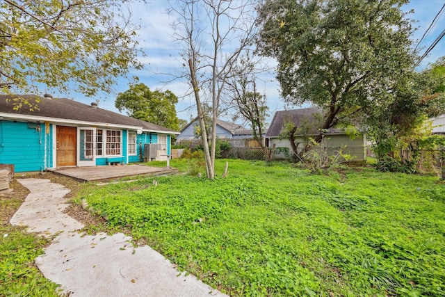 view of yard with a fenced backyard and cooling unit