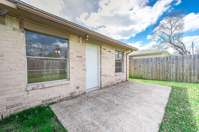 view of patio featuring fence