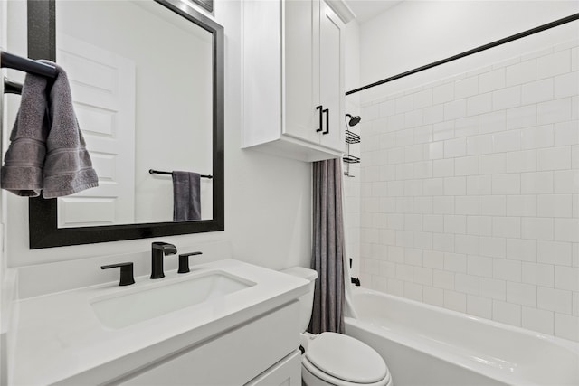 bathroom with vanity, toilet, and shower / bath combo with shower curtain