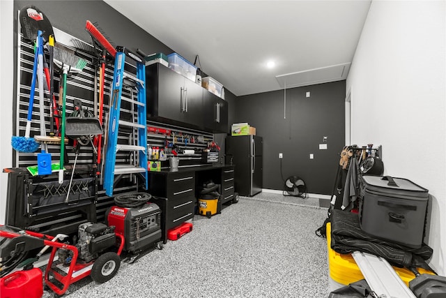 interior space with speckled floor and attic access