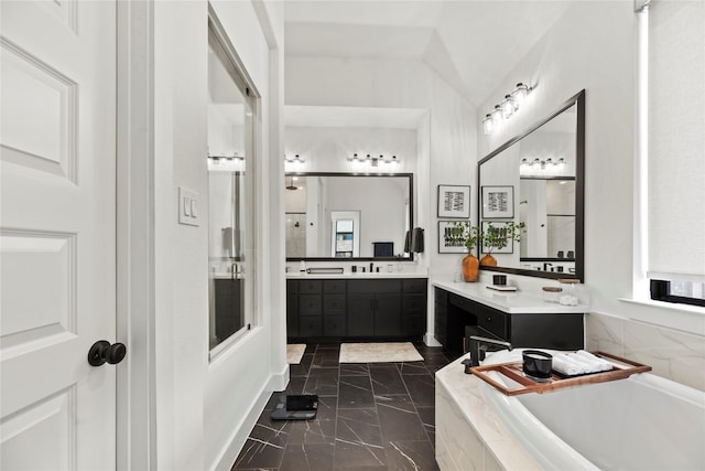 full bathroom with marble finish floor, a shower with shower door, two vanities, and a bath