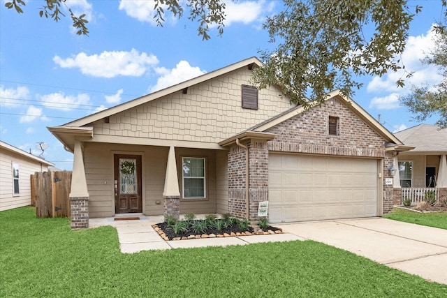 view of front of home with covered porch, brick siding, a front yard, and a garage