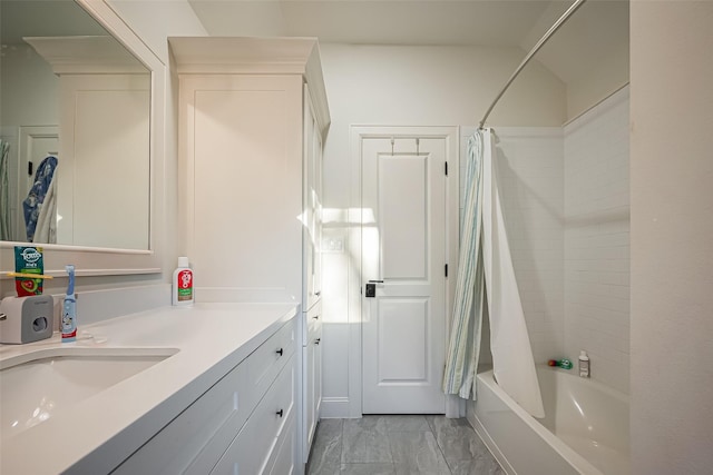 full bath with vanity, shower / bathtub combination with curtain, and marble finish floor