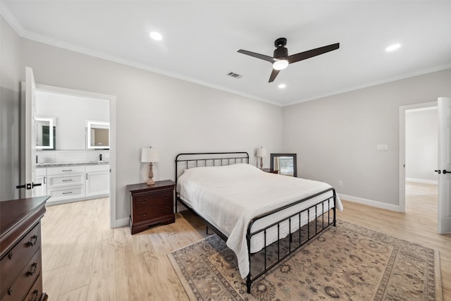 bedroom with ornamental molding, light wood-type flooring, and visible vents