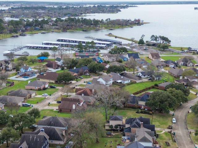 bird's eye view featuring a water view and a residential view