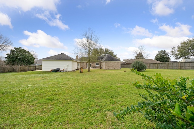 view of yard with a fenced backyard