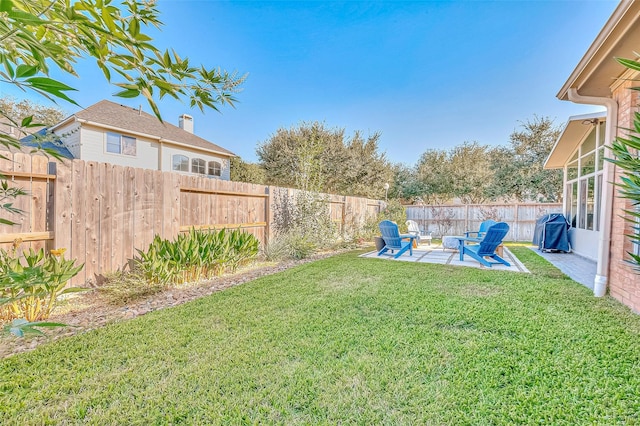 view of yard with a patio area and a fenced backyard