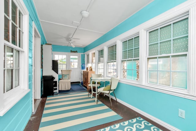 sunroom / solarium with ceiling fan