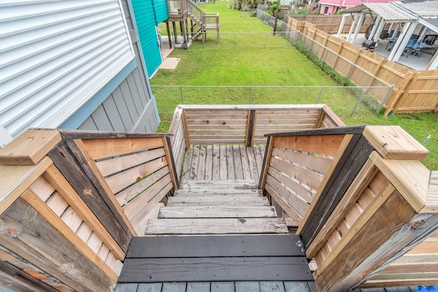 exterior space with fence and a yard